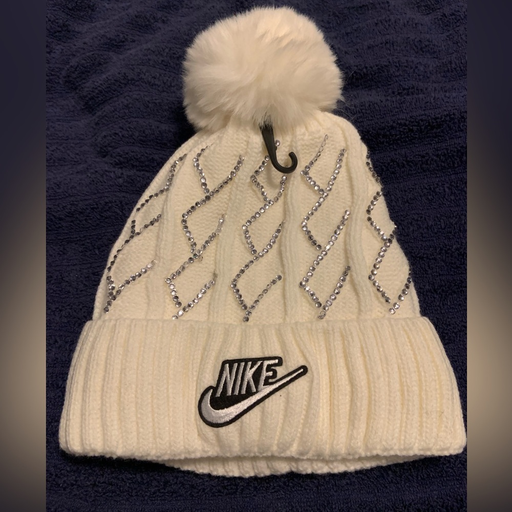 NIKE WINTER HAT WITH FAUX FUR LINING AND POM POM W/RHINESTONES ONE SIZE FITS ALL